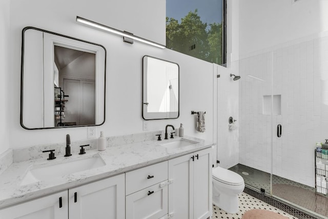 4614 Gillis St Unit 1, Austin, TX 78745 - bathroom with toilet, a stall shower, and double vanity