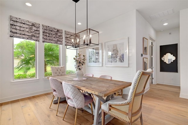 125 Reataway Dr, Dripping Springs, TX 78620 - dining room with baseboards, light wood finished floors, a chandelier, and recessed lighting