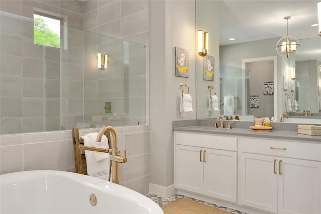 125 Reataway Dr, Dripping Springs, TX 78620 - bathroom with a tile shower, a freestanding bath, and vanity