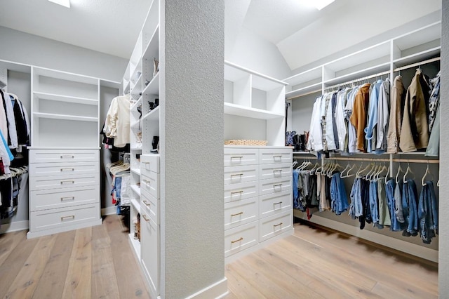 125 Reataway Dr, Dripping Springs, TX 78620 - walk in closet featuring light wood finished floors and vaulted ceiling