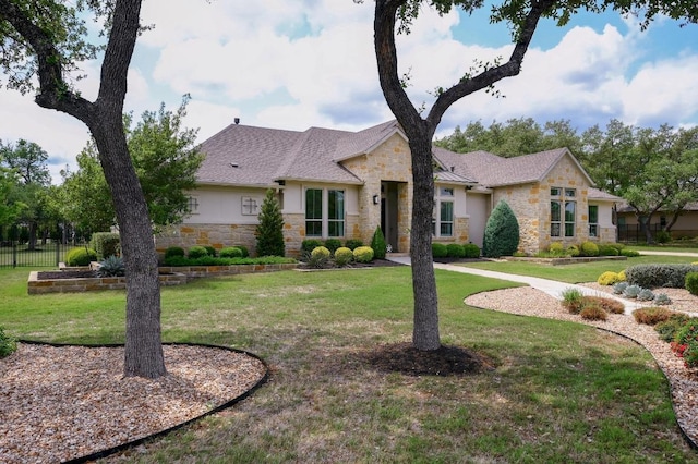 125 Reataway Dr, Dripping Springs, TX 78620 - view of front facade featuring stone siding and stucco siding