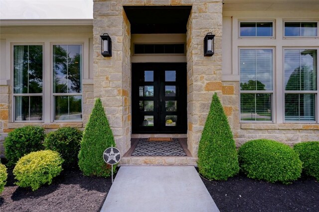 125 Reataway Dr, Dripping Springs, TX 78620 - entrance to property with stone siding and french doors