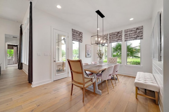 125 Reataway Dr, Dripping Springs, TX 78620 - dining area featuring plenty of natural light, light wood-type flooring, a chandelier, baseboards, and recessed lighting