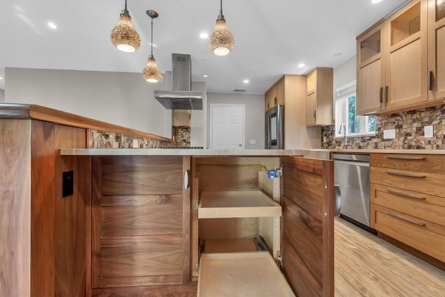 4807 Gerona Dr, Austin, TX 78759 - kitchen with appliances with stainless steel finishes, island range hood, tasteful backsplash, light countertops, and light wood-style flooring