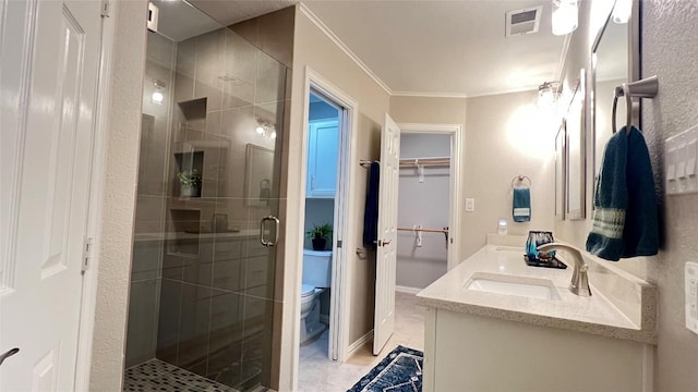 4807 Gerona Dr, Austin, TX 78759 - full bath with a stall shower, double vanity, ornamental molding, and a walk in closet