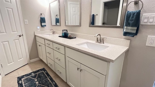 4807 Gerona Dr, Austin, TX 78759 - bathroom featuring double vanity and tile patterned flooring