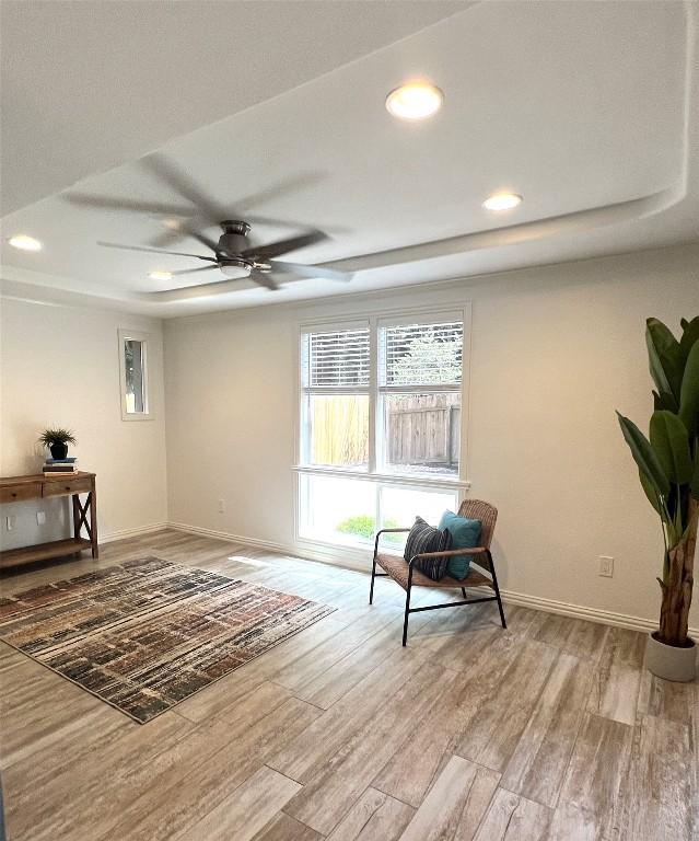 4807 Gerona Dr, Austin, TX 78759 - living area with a raised ceiling, light wood-style floors, and recessed lighting