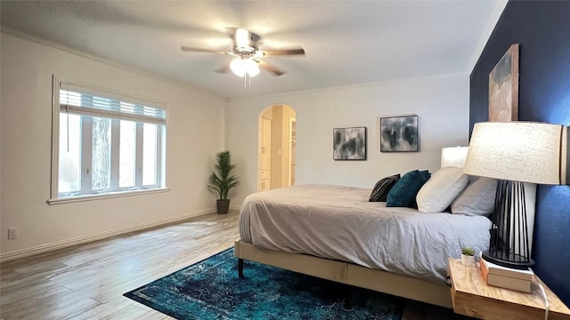 4807 Gerona Dr, Austin, TX 78759 - bedroom with arched walkways, wood finished floors, and ceiling fan