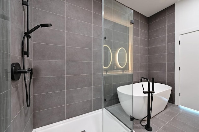 2209 S 1st St Unit 408, Austin, TX 78704 - bathroom with a stall shower, a freestanding bath, and tile patterned flooring