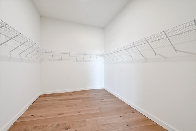 2209 S 1st St Unit 408, Austin, TX 78704 - walk in closet featuring light wood-style floors