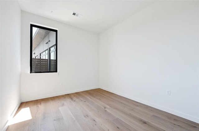 2209 S 1st St Unit 408, Austin, TX 78704 - empty room featuring wood finished floors and baseboards