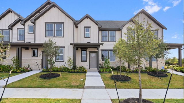 2540 Ophelia Levi Ln, Round Rock, TX 78665 - townhome / multi-family property with board and batten siding and a front yard