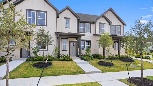 2540 Ophelia Levi Ln, Round Rock, TX 78665 - townhome / multi-family property with board and batten siding and a front lawn