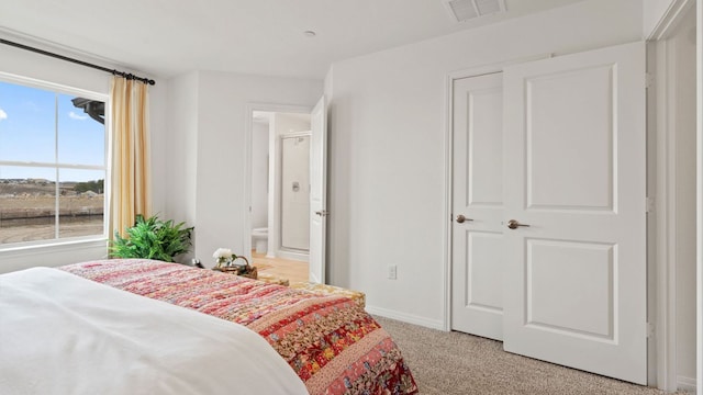 2540 Ophelia Levi Ln, Round Rock, TX 78665 - bedroom with baseboards, visible vents, light carpet, and multiple windows