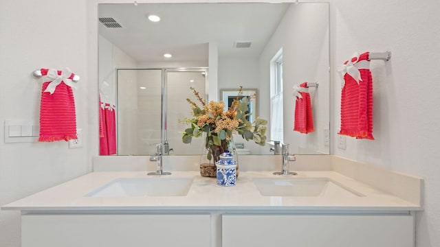 2540 Ophelia Levi Ln, Round Rock, TX 78665 - full bath with double vanity, visible vents, a sink, and a stall shower