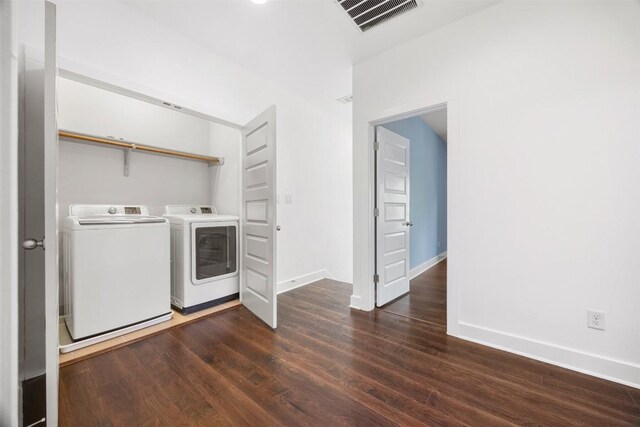 2011 Haskell St Unit A, Austin, TX 78702 - laundry room featuring washing machine and clothes dryer, wood finished floors, and baseboards