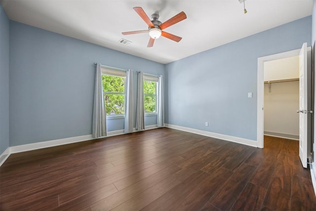 2011 Haskell St Unit A, Austin, TX 78702 - empty room featuring dark wood-type flooring, a ceiling fan, and baseboards