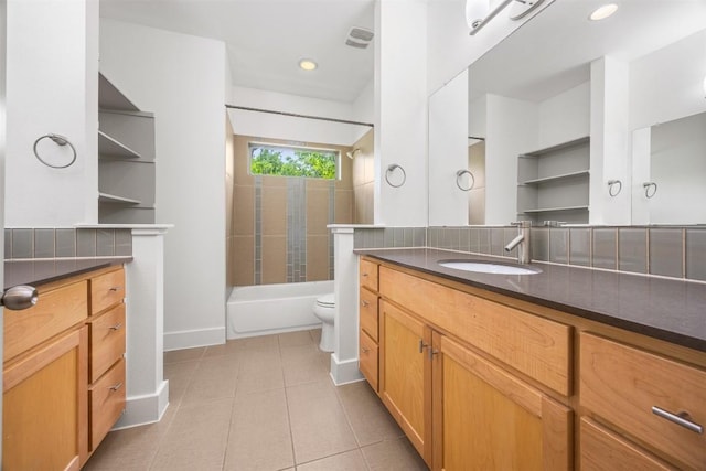 2011 Haskell St Unit A, Austin, TX 78702 - full bath featuring toilet, vanity, tile patterned flooring, shower / bath combination, and baseboards