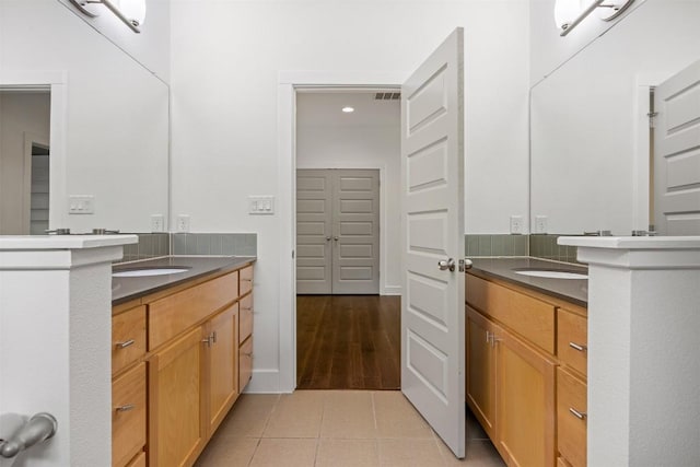 2011 Haskell St Unit A, Austin, TX 78702 - bathroom with two vanities, tile patterned floors, and recessed lighting
