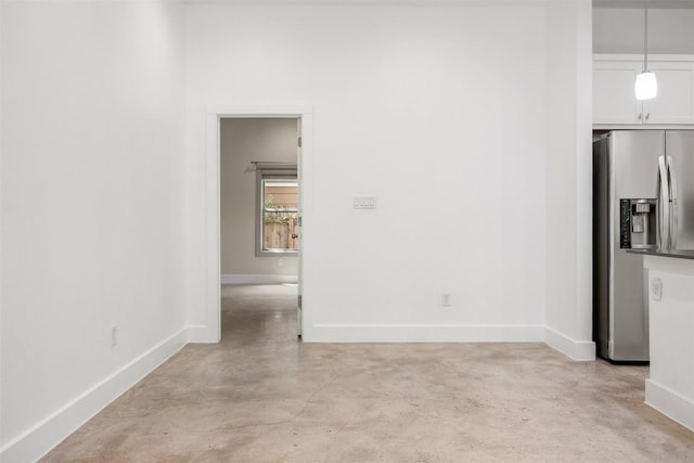 2011 Haskell St Unit A, Austin, TX 78702 - unfurnished dining area featuring finished concrete flooring and baseboards