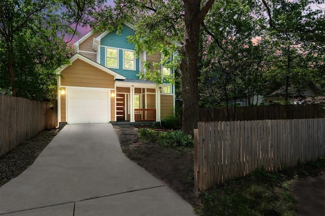 2011 Haskell St Unit A, Austin, TX 78702 - traditional-style home featuring concrete driveway, a porch, and a garage