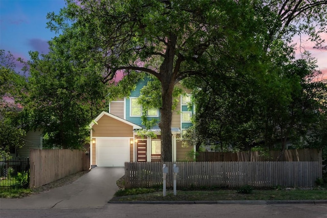 2011 Haskell St Unit A, Austin, TX 78702 - view of property hidden behind natural elements featuring a fenced front yard and driveway