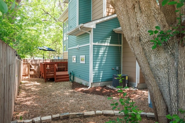 2011 Haskell St Unit A, Austin, TX 78702 - view of side of property with a fenced backyard, a deck, and central AC