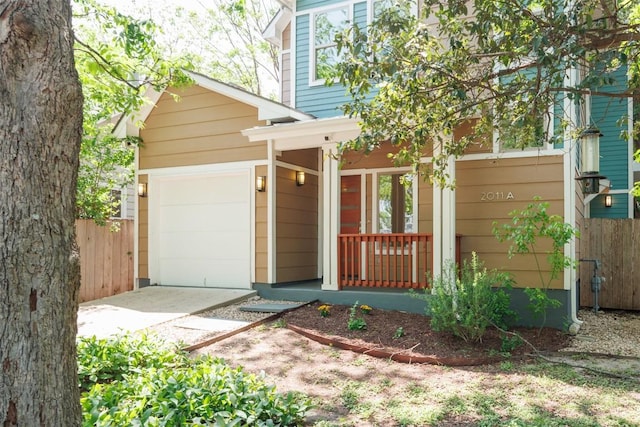 2011 Haskell St Unit A, Austin, TX 78702 - view of front of property with covered porch, concrete driveway, and a garage