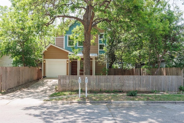 2011 Haskell St Unit A, Austin, TX 78702 - view of front of property with driveway, a fenced front yard, and a garage