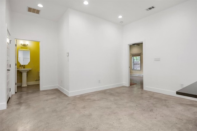 2011 Haskell St Unit A, Austin, TX 78702 - unfurnished room featuring concrete flooring, baseboards, and recessed lighting