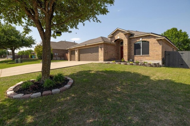 1416 Muddy Waters Dr, Pflugerville, TX 78660 - view of front of property featuring brick siding, driveway, and a garage