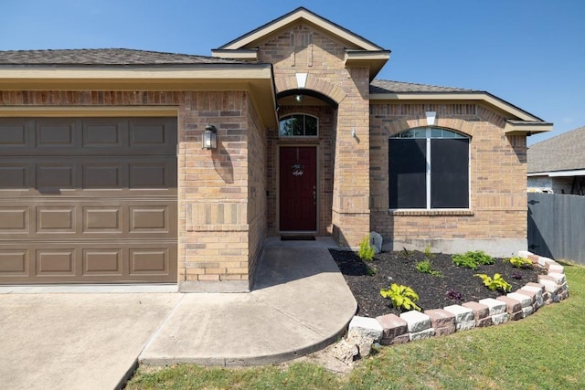 1416 Muddy Waters Dr, Pflugerville, TX 78660 - view of front facade featuring brick siding, an attached garage, and a shingled roof