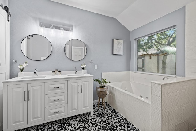 1416 Muddy Waters Dr, Pflugerville, TX 78660 - full bath with double vanity, lofted ceiling, and a whirlpool tub