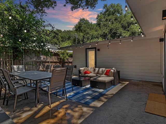 5800 Marilyn Dr, Austin, TX 78757 - patio terrace at dusk featuring a patio area, outdoor lounge area, and outdoor dining area