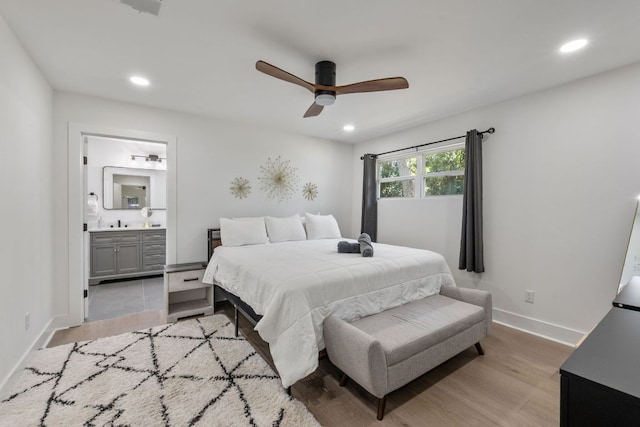 5800 Marilyn Dr, Austin, TX 78757 - bedroom featuring recessed lighting, light wood-style floors, ensuite bath, baseboards, and ceiling fan