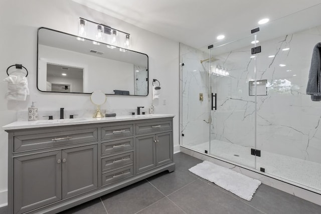 5800 Marilyn Dr, Austin, TX 78757 - bathroom featuring double vanity, a marble finish shower, tile patterned flooring, and recessed lighting