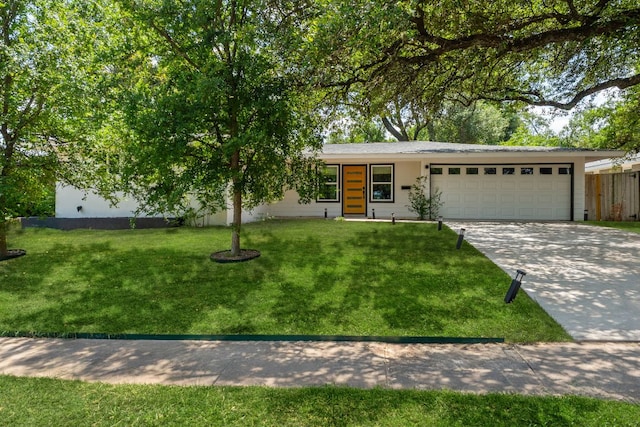 5800 Marilyn Dr, Austin, TX 78757 - view of front of property with an attached garage and concrete driveway