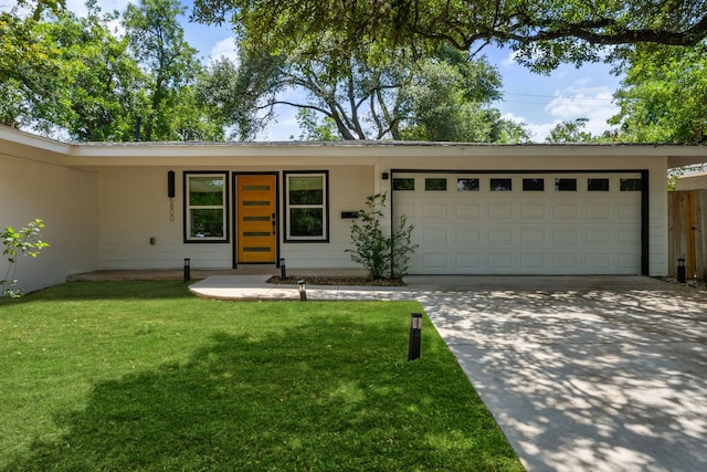 5800 Marilyn Dr, Austin, TX 78757 - ranch-style home featuring a front yard, concrete driveway, and a garage