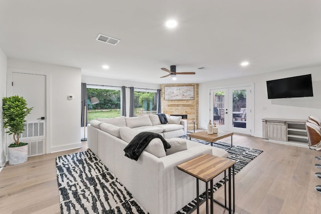 5800 Marilyn Dr, Austin, TX 78757 - living room featuring ceiling fan, light wood-style floors, recessed lighting, french doors, and a fireplace