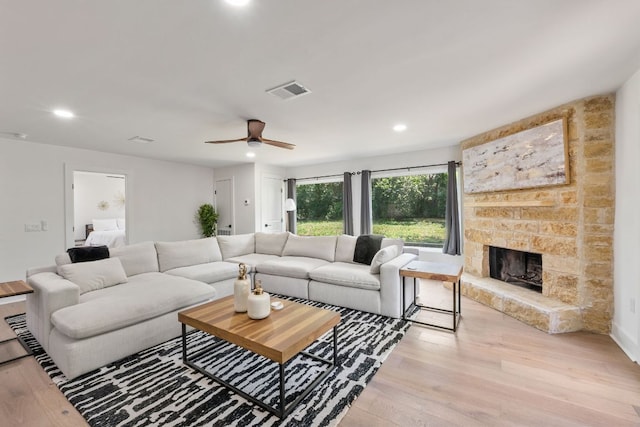 5800 Marilyn Dr, Austin, TX 78757 - living room with light wood-style floors, recessed lighting, a fireplace, and a ceiling fan