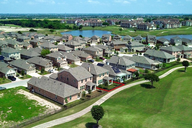 birds eye view of property with a residential view and a water view