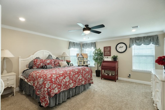carpeted bedroom with baseboards, visible vents, recessed lighting, a ceiling fan, and crown molding