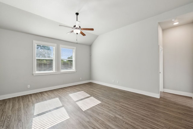 206 N Winston Dr, Fredericksburg, TX 78624 - empty room with vaulted ceiling, wood finished floors, baseboards, and ceiling fan