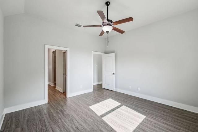 206 N Winston Dr, Fredericksburg, TX 78624 - unfurnished bedroom featuring dark wood finished floors, lofted ceiling, and visible vents