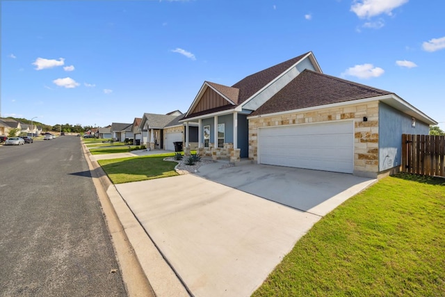 206 N Winston Dr, Fredericksburg, TX 78624 - view of front of house with a residential view, driveway, fence, an attached garage, and a front yard