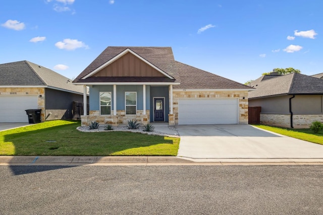 206 N Winston Dr, Fredericksburg, TX 78624 - craftsman-style house featuring a garage, driveway, stone siding, board and batten siding, and a front yard