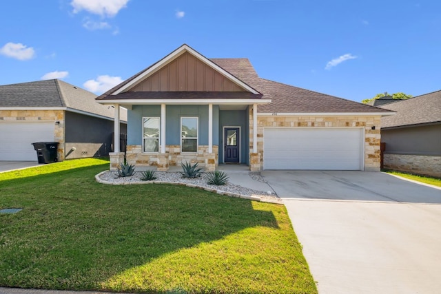206 N Winston Dr, Fredericksburg, TX 78624 - view of front facade with a front lawn, an attached garage, driveway, stone siding, and a porch