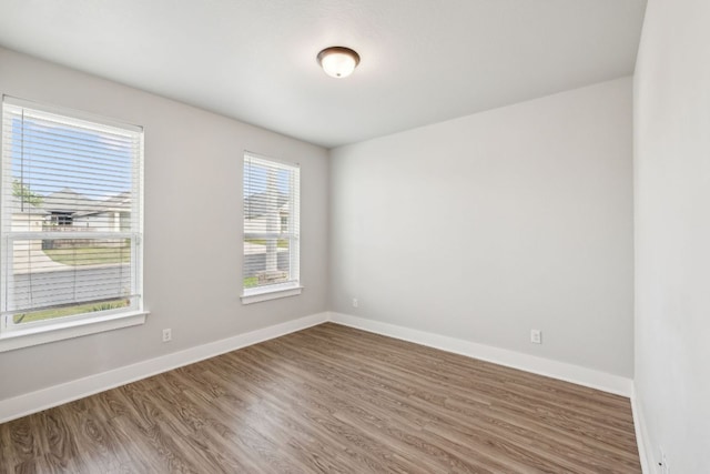 206 N Winston Dr, Fredericksburg, TX 78624 - spare room with baseboards and wood finished floors