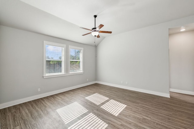 206 N Winston Dr, Fredericksburg, TX 78624 - spare room with baseboards, a ceiling fan, wood finished floors, and vaulted ceiling