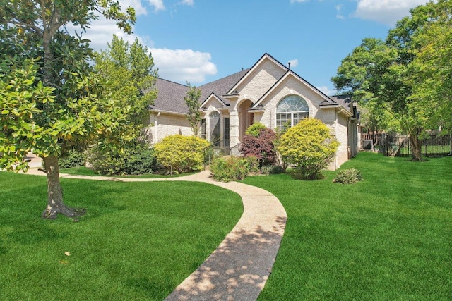 10120 Treasure Island Dr, Austin, TX 78730 - view of front of home with brick siding and a shingled roof